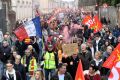 Protestors take part in a demonstration against pension reforms in Montpellier, southern France