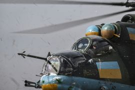 The Ukrainian crew of a Mi-24 fighting helicopter prepares to take off for a mission against Russian targets on March 26, 2023 [Aris Messinis / AFP]