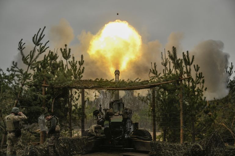 Ukrainian service members fire a French TRF-1 155mm howitzer towards Russian positions.
