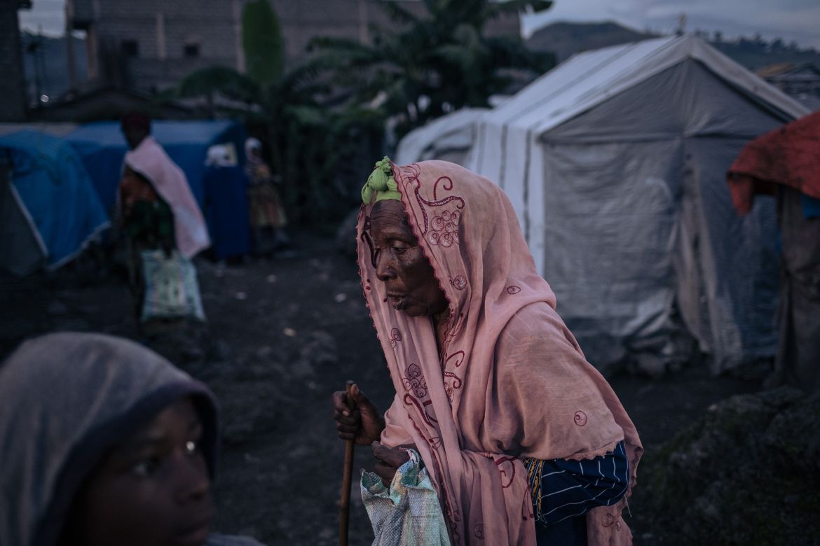An elderly displaced Muslim woman walks to the mosque in an informal displacement camp to break the Ramadan fast in Goma, eastern Democratic Republic of Congo, March 27, 2023.