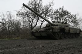 A Ukrainian tank rolls on a muddy road near Bakhmut, Donetsk region, on March 29, 2023 [Genya SAVILOV/AFP]