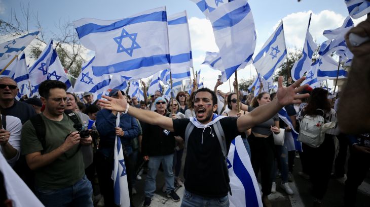 Israelis protest during a demonstration after Israeli Prime Minister Benjamin Netanyahu dismissed the defence minister