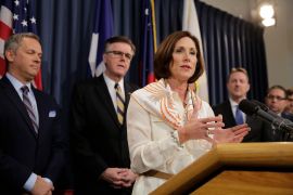 FILE - In this March 6, 2017, file photo, Texas Sen. Lois Kolkhorst, front, backed by Texas Lt. Gov. Dan Patrick, center, and other legislators talks to the media during a news conference to discuss Senate Bill 6 at the Texas Capitol in Austin, Texas. Just months after a high-profile study revealed that Texas has one of the highest maternal mortality rates in the developed world, state lawmakers failed to respond by passing comprehensive legislation to combat the crisis during the legislative session. (AP Photo/Eric Gay, File)