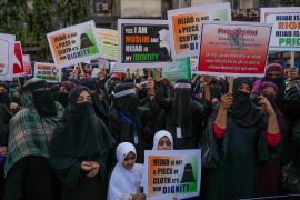Indian Muslim women shout slogans against banning Muslim girls wearing hijab from attending classes at some schools in the southern Indian state of Karnataka during a protest in Mumbai, India, Sunday, Feb. 13, 2022. (AP Photo/Rafiq Maqbool)