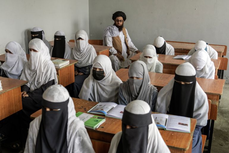 Afghan girls attend a religious school
