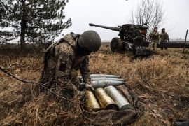 A Ukrainian serviceman prepares artillery shells [File: Kateryna Klochko/AP Photo]