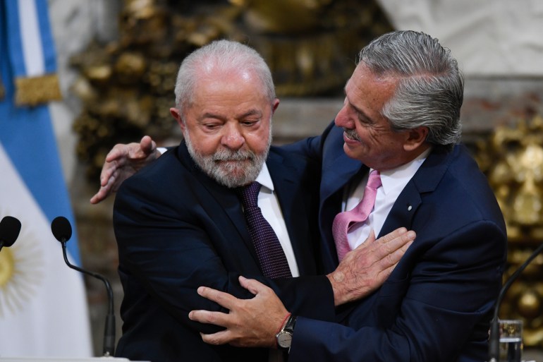 Brazilian President Luiz Inacio Lula da Silva, left, and Argentina's President Alberto Fernandez embrace at the government house in Buenos Aires, Argentina, Monday, Jan. 23, 2023. (AP Photo/Gustavo Garello)