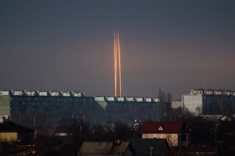 Three Russian rockets launched against Ukraine from Russia's Belgorod region are seen at dawn in Kharkiv, Ukraine
