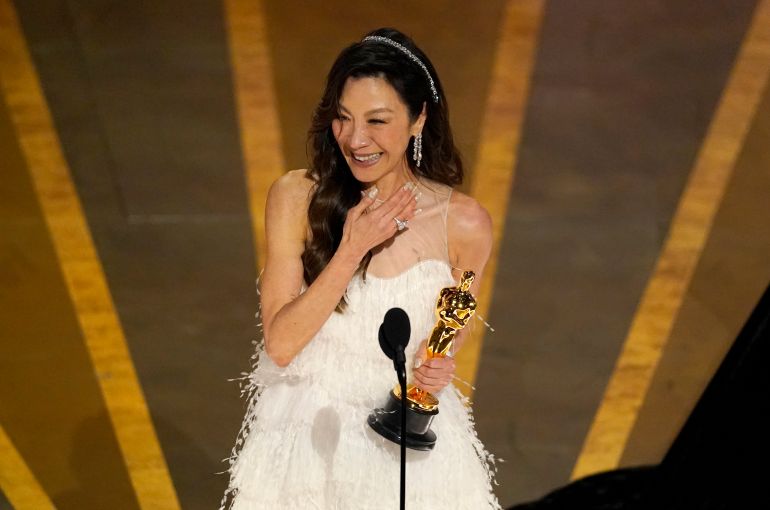 Michelle Yeoh holds her Oscar