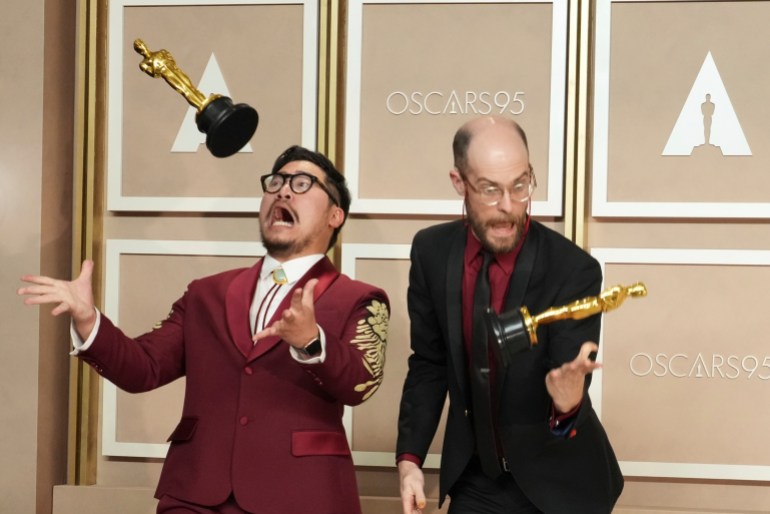 The Daniels toss their Oscars in the air