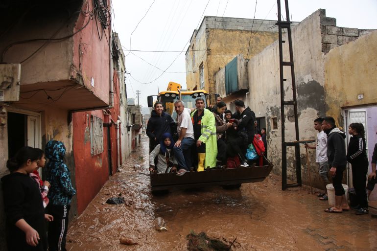 People are rescued during floods after heavy rains in Sanliurfa