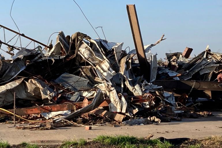 Debris covers a damaged structure in Rolling Fork, Miss,. on Saturday, March 25, 2023. Powerful tornadoes tore through the Deep South on Friday night, killing several people in Mississippi, obliterating dozens of buildings. (AP Photo/Rogelio Solis)