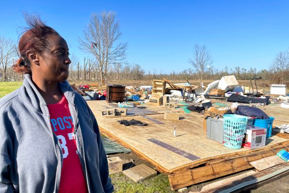 Kimberly Berry looks at what's left of her home after a massive storm in Mississippi