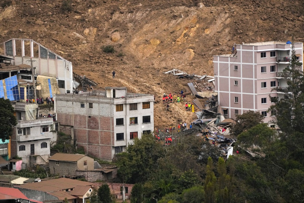 Rescue work is carried out at the site of a landslide that buried dozens of homes in Alausi, Ecuador