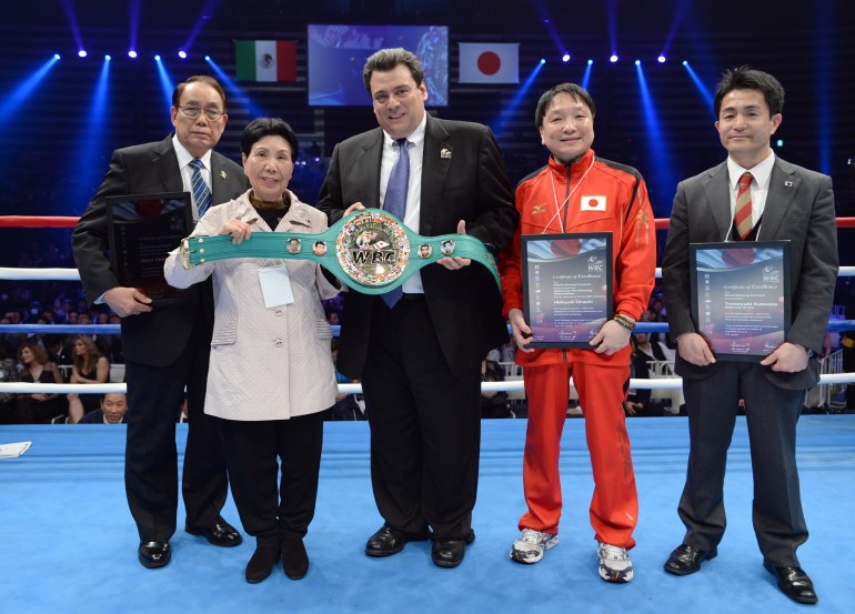 Hideko poses with an honorary boxing belt given by the WBC prior to a flyweight boxing bout