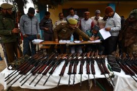 JKP cops distribute SLR Rifle among Ex Servicemen after Village defence groups or VDC are being revamped in Dangri village of Rajouri Jammu and Kashmir