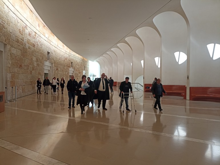 Lawyers and people walking around in the building of the Supreme Court of Israel in West Jerusalem