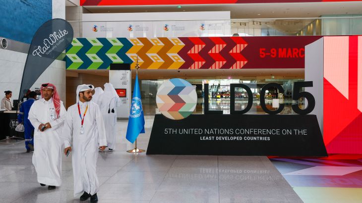 Delegates walk through the Qatar National Convention Centre during the fifth conference on the Least Developed Countries in Doha