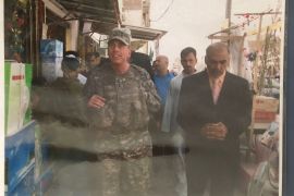 Abdul Qadir Al-Dulaimi, right, walks alongside US General David Petraeus in Iraq after the 2003 US invasion. Al-Dulaimi is now seeking a protective visa to flee to the US [Photo courtesy of Abdul Qadir Al-Dulaimi]