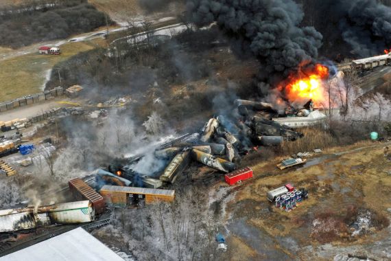 A photo shows the a fire blazing in the aftermath of a train derailment in East Palestine, Ohio in February