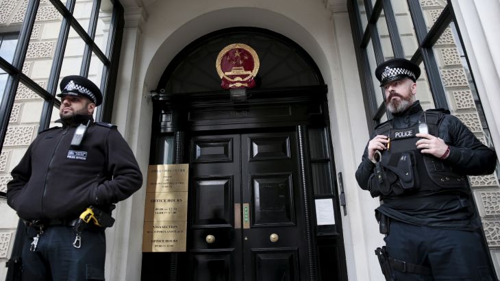 Policemen stand guard outside the Chinese Embassy in London, Britain October 18, 2015. Chinese President Xi Jinping arrives in Britain on Monday for a state visit at the invitation of Queen Elizabeth II, the first state visit to the United Kingdom by a Chinese leader since 2005. REUTERS/Suzanne Plunkett