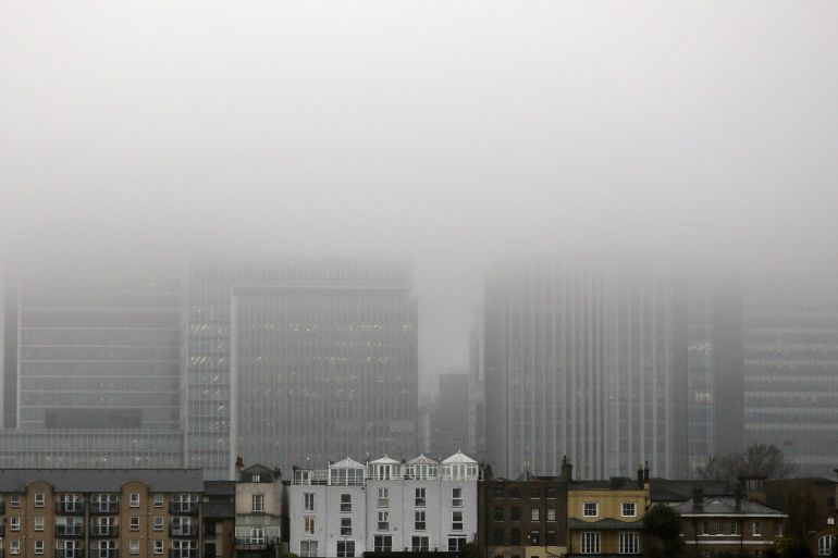 A low fog engulfs the skyscrapers of the financial district of Canary Wharf in London, Britain April 9, 2018. REUTERS/Kevin Coombs