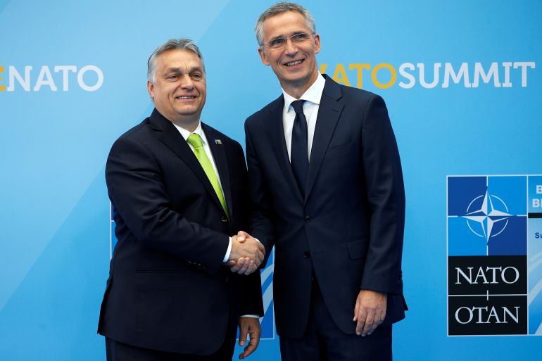 Hungarian Prime Minister Viktor Orban is greeted by NATO Secretary General Jens Stoltenberg before a summit of heads of state and government at NATO headquarters in Brussels, Belgium July 11, 2018. Francois Mori/Pool via REUTERS