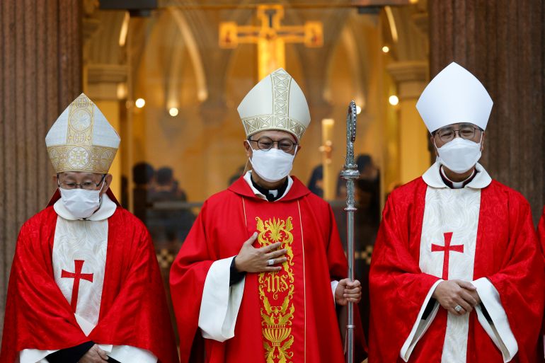 Stephen Chow at his ordination as Bishop of Hong Kong in 2021. He is wearing a red robe with a white mitre. He is also wearing a face mask because of the COVID-19 pandemic.