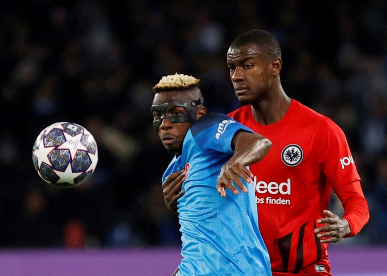 Napoli's Victor Osimhen in action with Eintracht Frankfurt's Obite Ndicka 