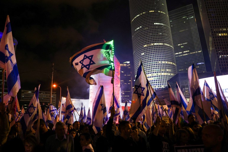 People participate in protests against the government in Tel Aviv