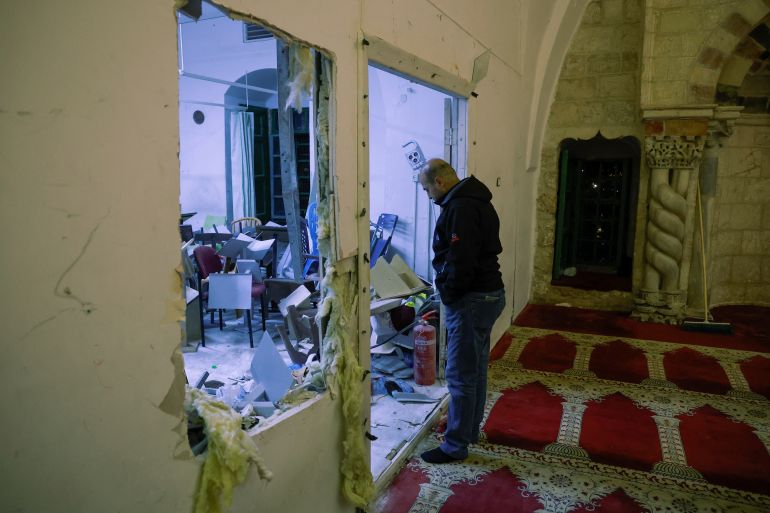 A man looks on inside the Al-Aqsa mosque
