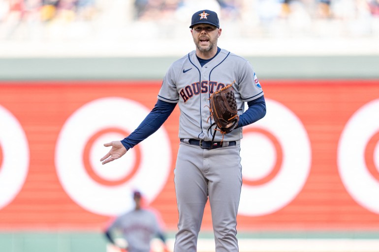 Houston Astros relief pitcher Ryan Pressly (55) argues a pitch clock violation against the Minnesota Twins in the ninth inning at Target Field