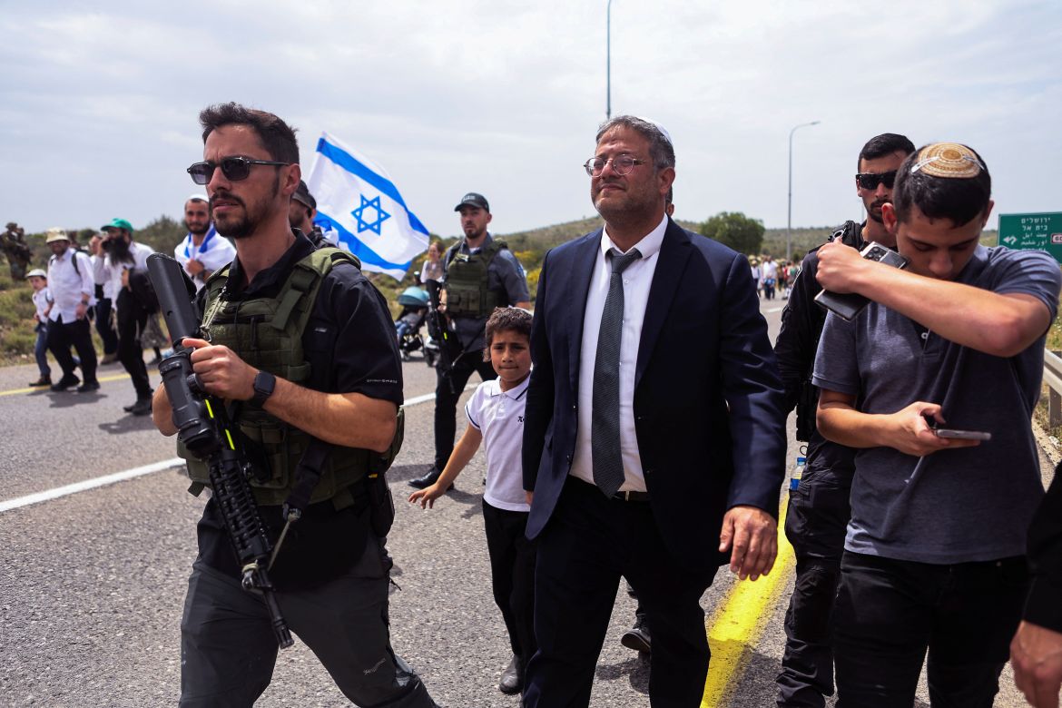Israeli Security Minister Itamar Ben-Gvir joins Israeli settlers as they hold a protest march from Tapuach Junction to the Israeli settler outpost of Evyatar,