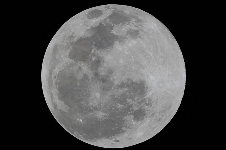 A full moon is seen over Mexico City