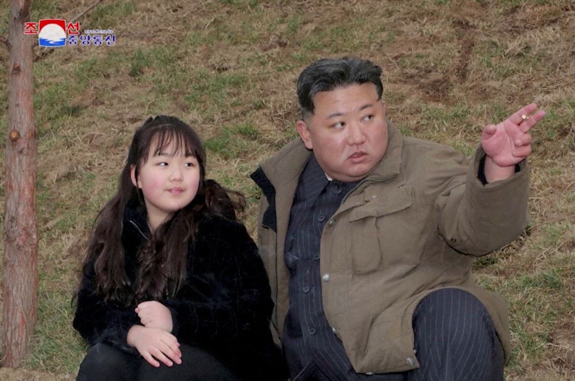 Kim Jong un and his daughter Kim Ju Ae looking up to the sky as they witness the ICBM test.