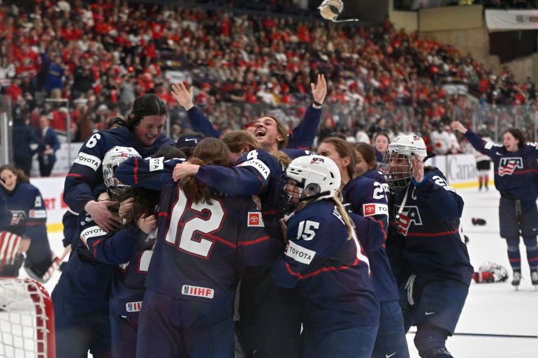 USA ice hockey players celebrate after defeating Canada