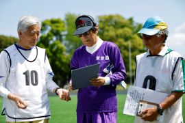 White Bear’s goalkeeper Shingo Shiozawa (centre), 93, talks with his teammates Akimichi Nakamachi (left), 82, and Kozo Ishida, 82,