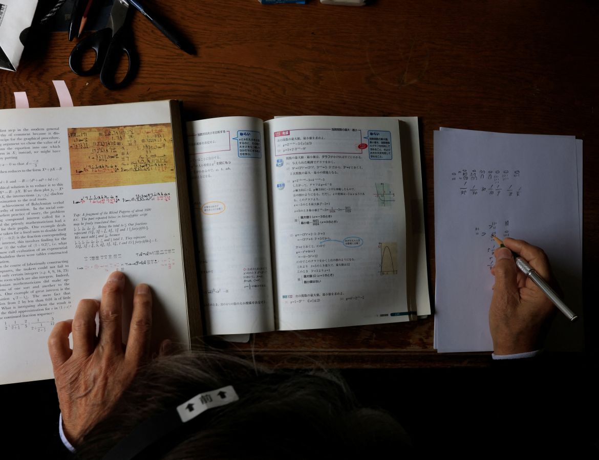 Shingo Shiozawa, 93, solves ancient math problems in Egyptian numbers to keep his mind sharp at his office in Tokyo