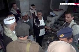 Officials visit the site after a stampede in Sanaa