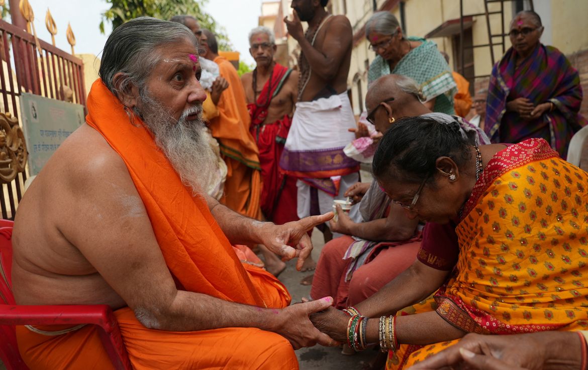 A resident of Mumukshu Bhavan, a community home for elderly wishing to live and end their twilight years in the sacred city of Varanasi, asks for release from physical pain from a holy man in Varanasi,