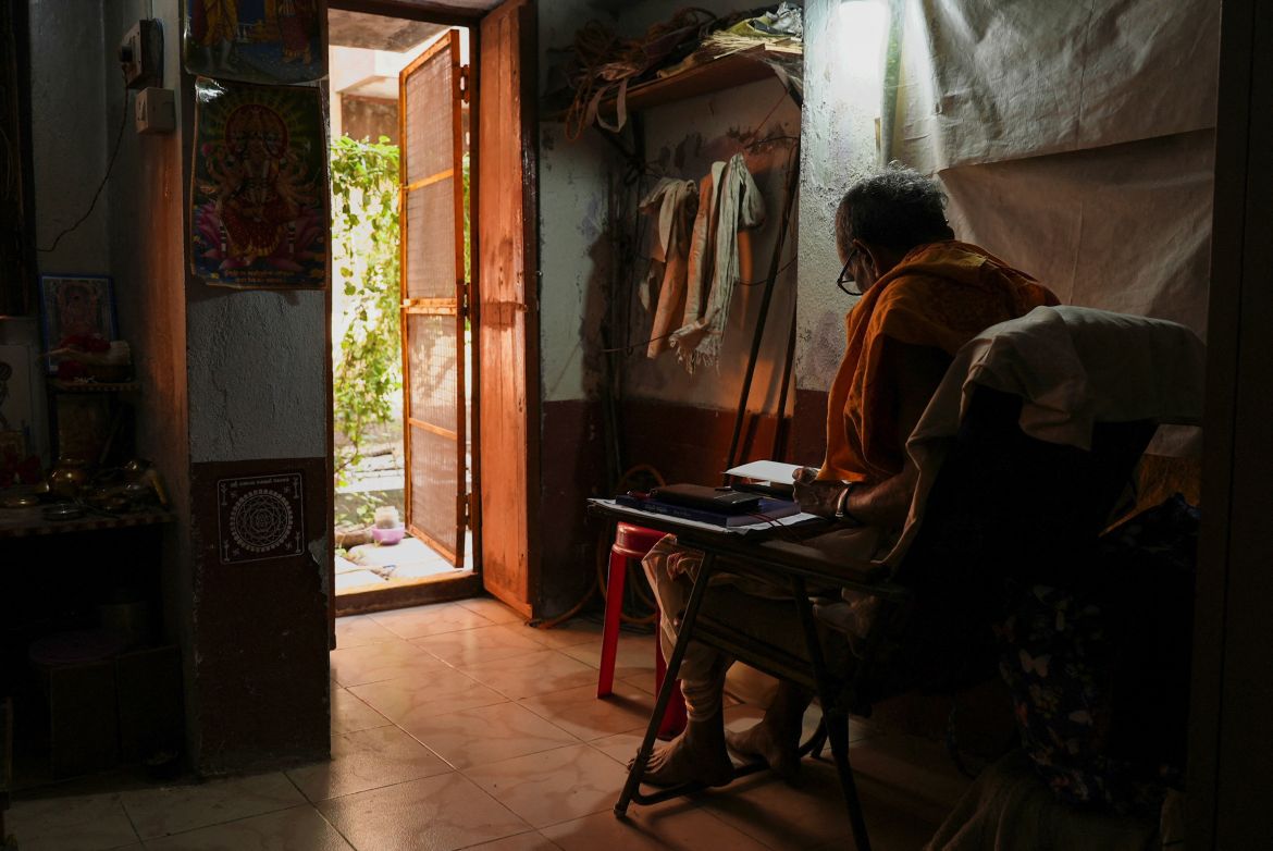 82-year-old retiree Murali Mohan Sastry studies in his quarters at Mumukshu Bhavan, a community home for elderly wishing to live and end their twilight years in the sacred city of Varanasi India