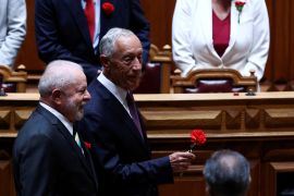 Brazil's President Luiz Inacio Lula da Silva walks with Portugal's President Marcelo Rebelo de Sousa as he visits the Portuguese parliament during the 49th anniversary of Portugal's Carnation Revolution, that resulted in the country's transition to democracy, in Lisbon, Portugal, April 25, 2023. REUTERS/Rodrigo Antunes