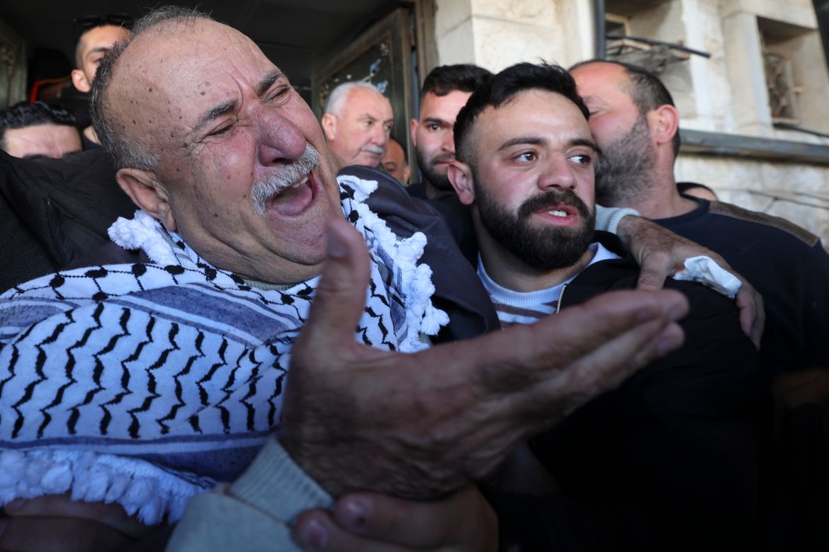 The father of Mohammed Abu Bakr, who was killed during the Israely army raid, mourns outside the Rafidiya hospital in the city of Nablus
