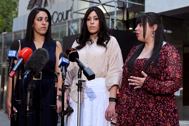 Sisters Elly Sapper (L), Nicole Meyer (C) and Dassi Erlich (R) speak to the media outside the County Court in Melbourne on April 3, 2023 after the trial of former school principal Malka Leife