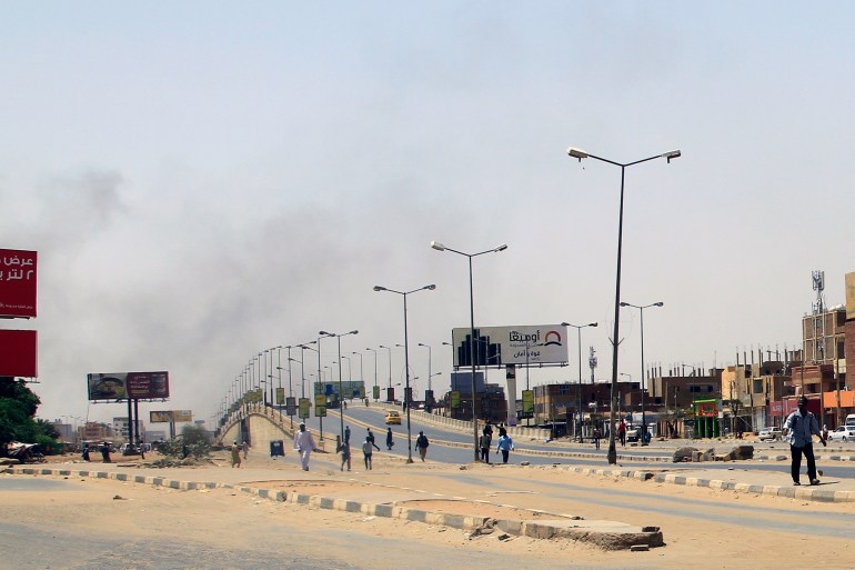 Smoke rises above buildings in Khartoum on April 15, 2023