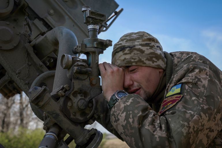 A Ukrainian artilleryman prepares a BM-21 Grad multiple rocket launcher to fire towards Russian positions on the frontline, in Donetsk region on April 17, 2023.