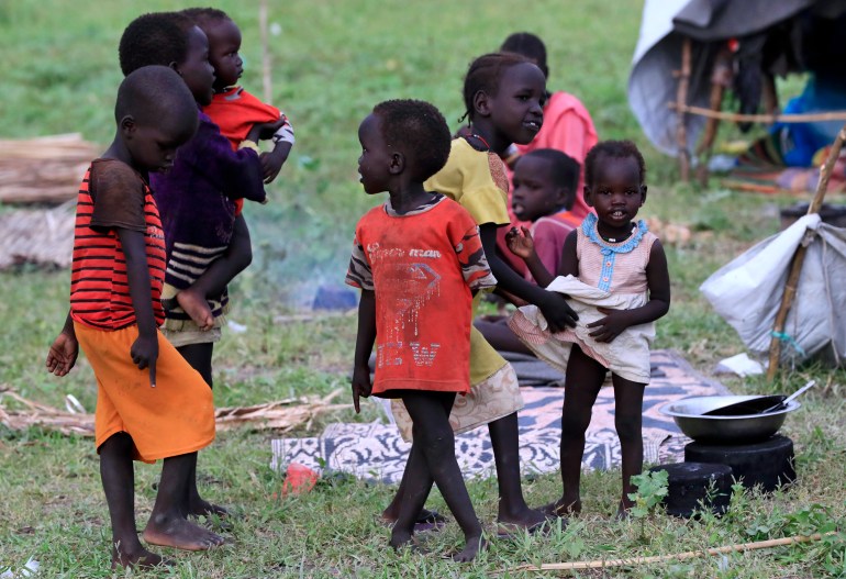 Small children playing at a refugee camp