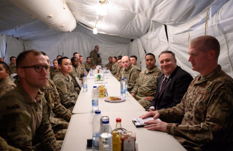 U.S. Secretary of State Mike Pompeo has lunch with members of the military during a visit to Prince Sultan Air Base in Al-Kharj, central Saudi Arabia, Thursday, Feb. 20, 2020. Pompeo met Saudi Arabia's King Salman on Thursday during a visit focused primarily on discussing shared security concerns with regional rival Iran.  (Andrew Caballero Reynolds/Pool via AP)