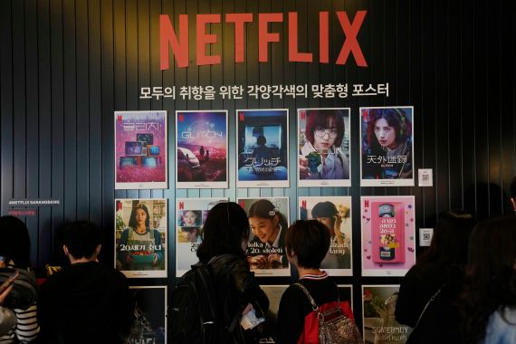 People look at 2022 Netflix Korea series and film posters