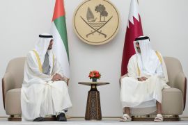 Qatari Emir Sheikh Tamim bin Hamad Al-Thani, right, greats UAE president Sheikh Mohamed bin Zayed Al-Nahyan